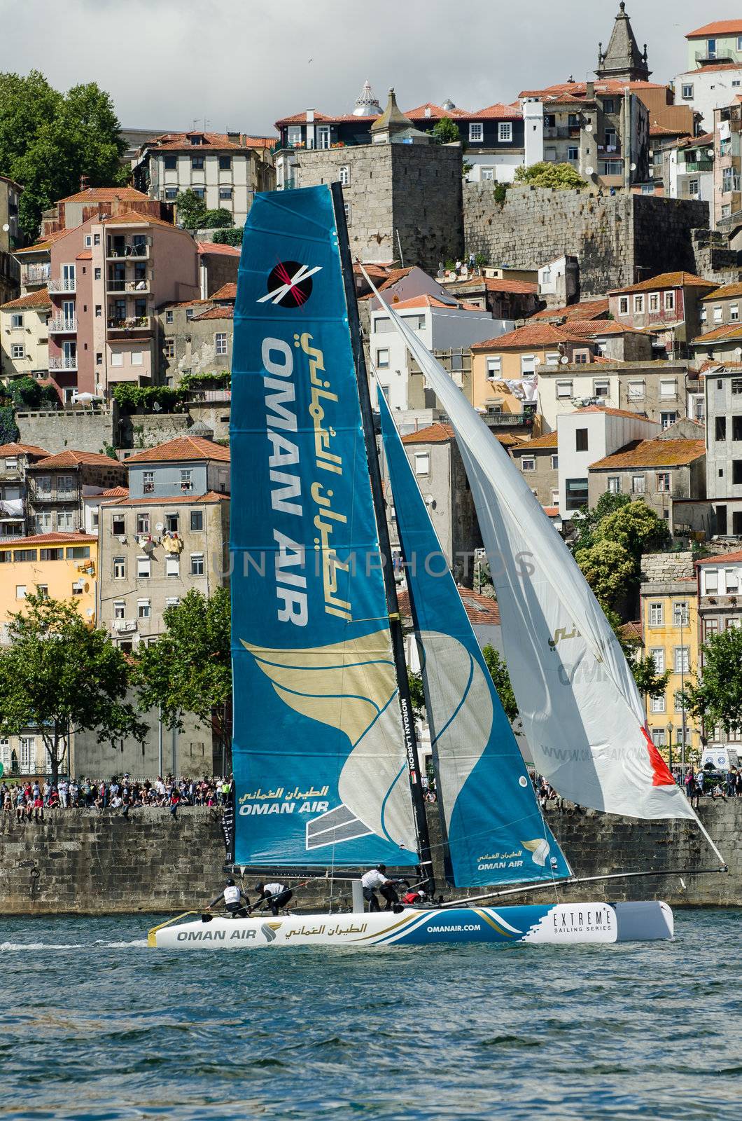 PORTO, PORTUGAL - JULY 07: Oman Air compete in the Extreme Sailing Series boat race on july 07, 2012 in Porto, Portugal.