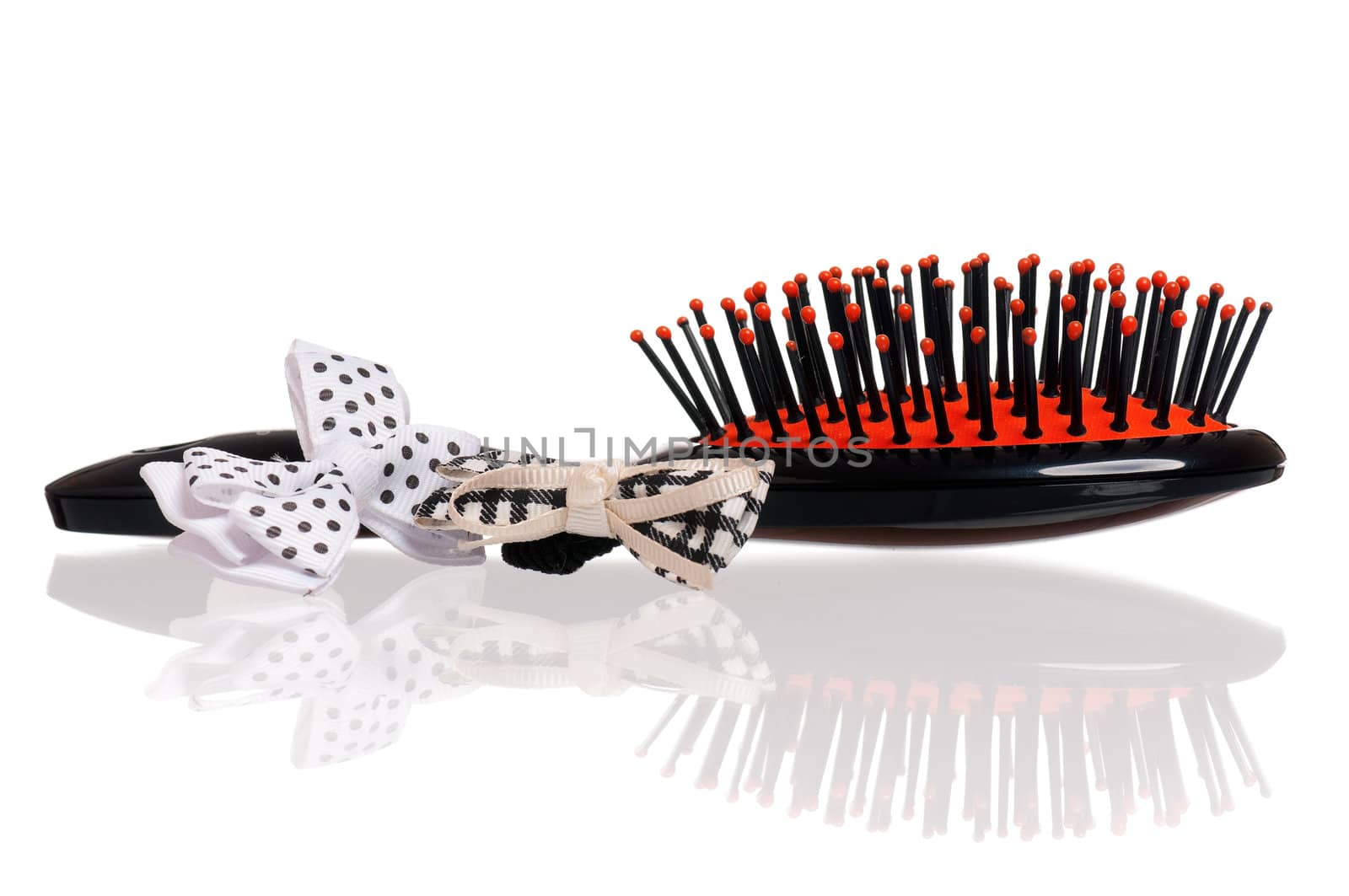 Small black hairbrush isolated on white background