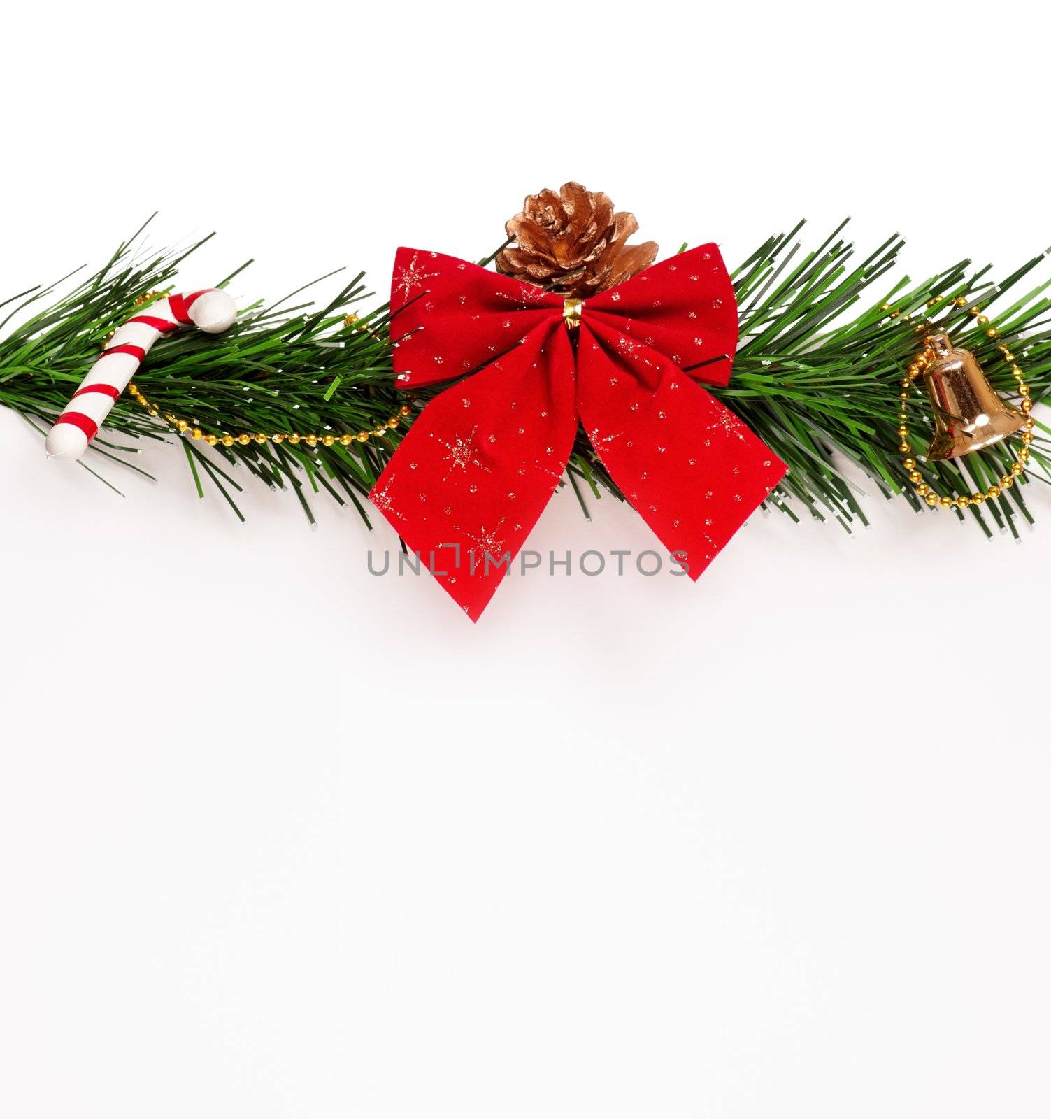 Christmas green artificial branch and red bow with empty board on white background