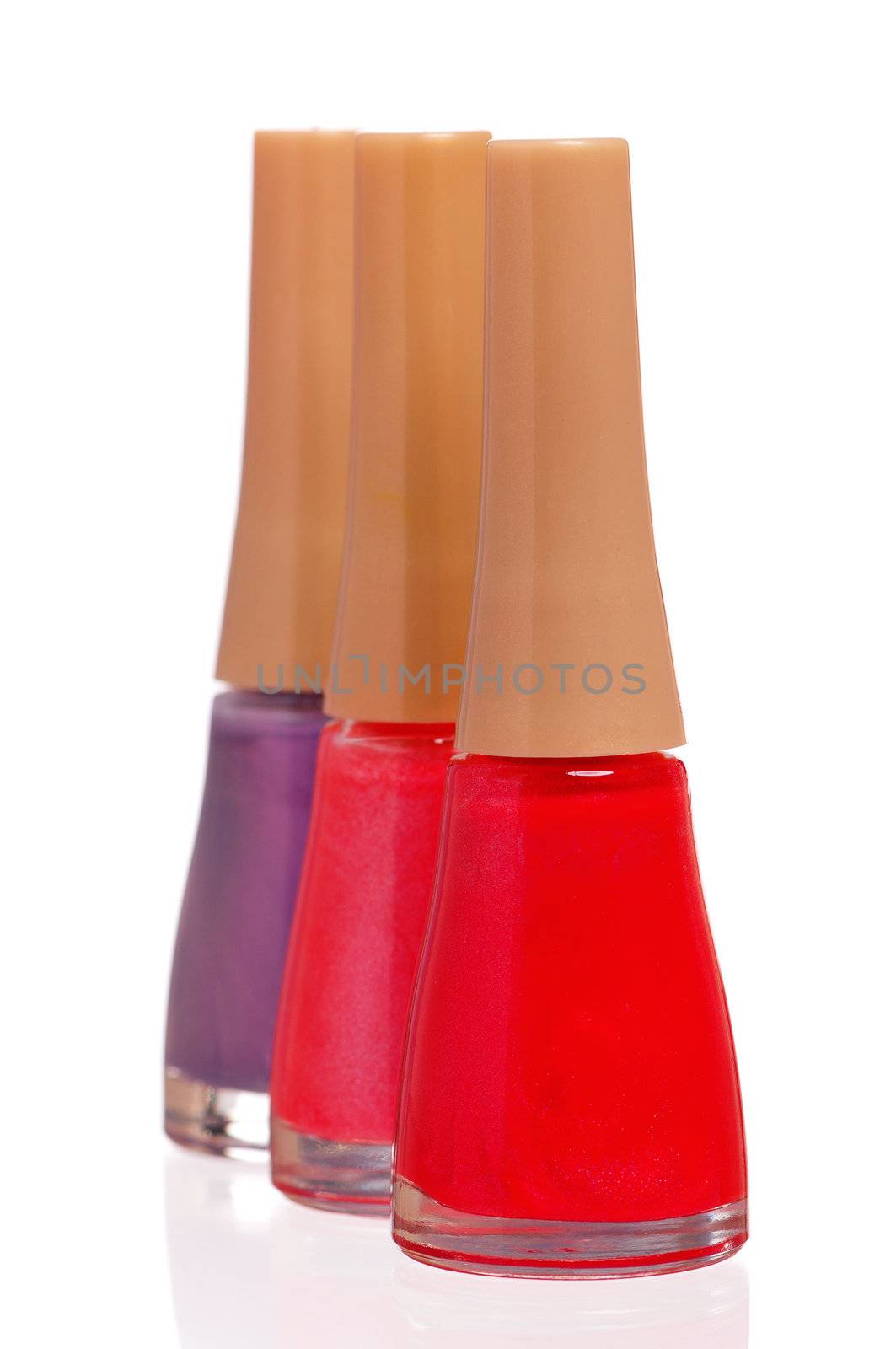 Three bottles of nail polish isolated on white background