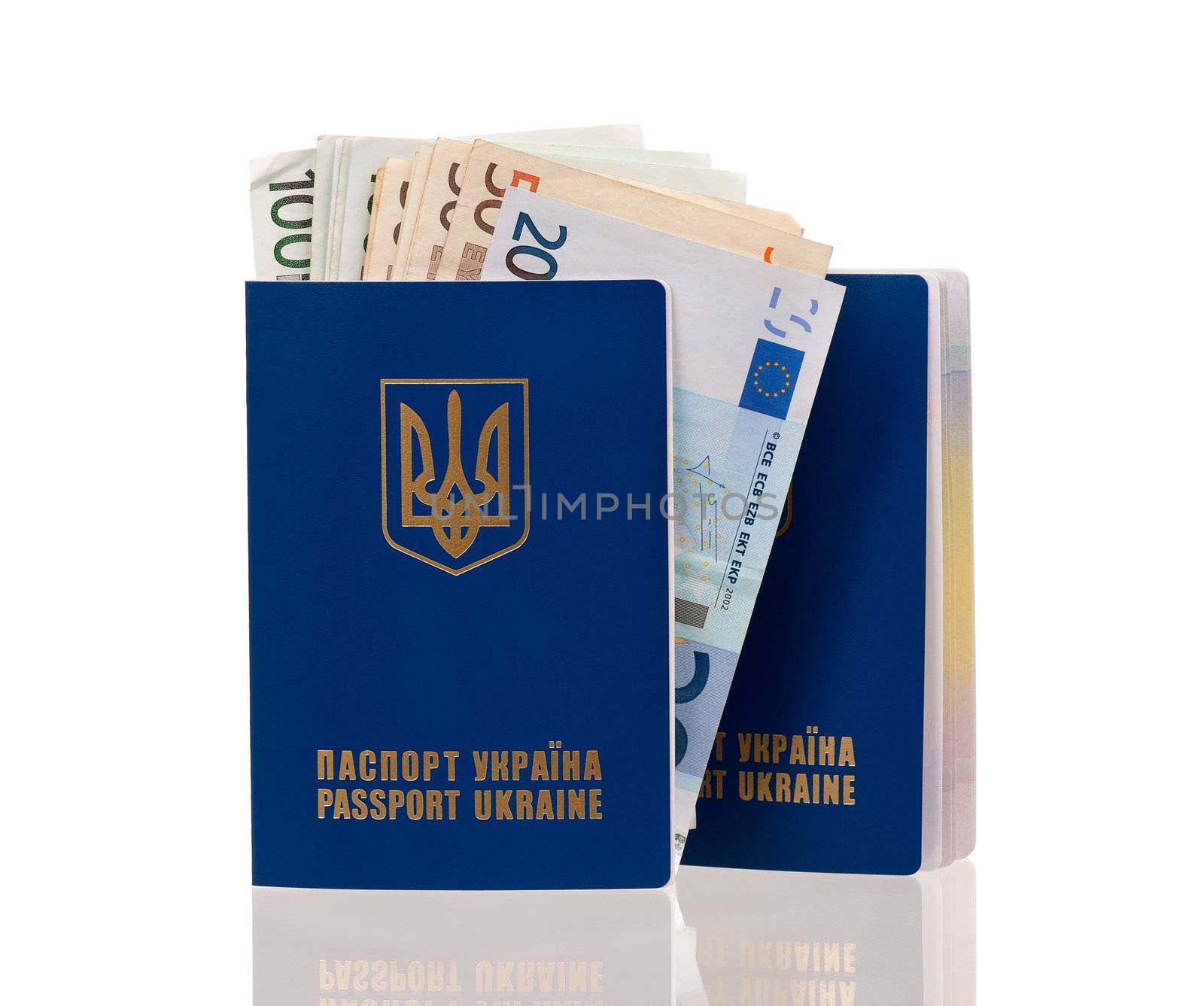 Two international Ukrainian passports with Euro banknotes isolated on background