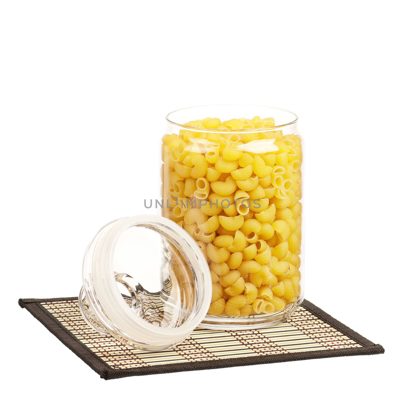 Pasta in glass pot isolated on white background