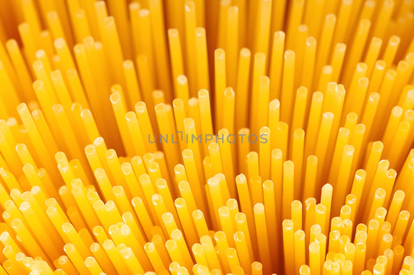 Close-up of long uncooked italian spaghetti background