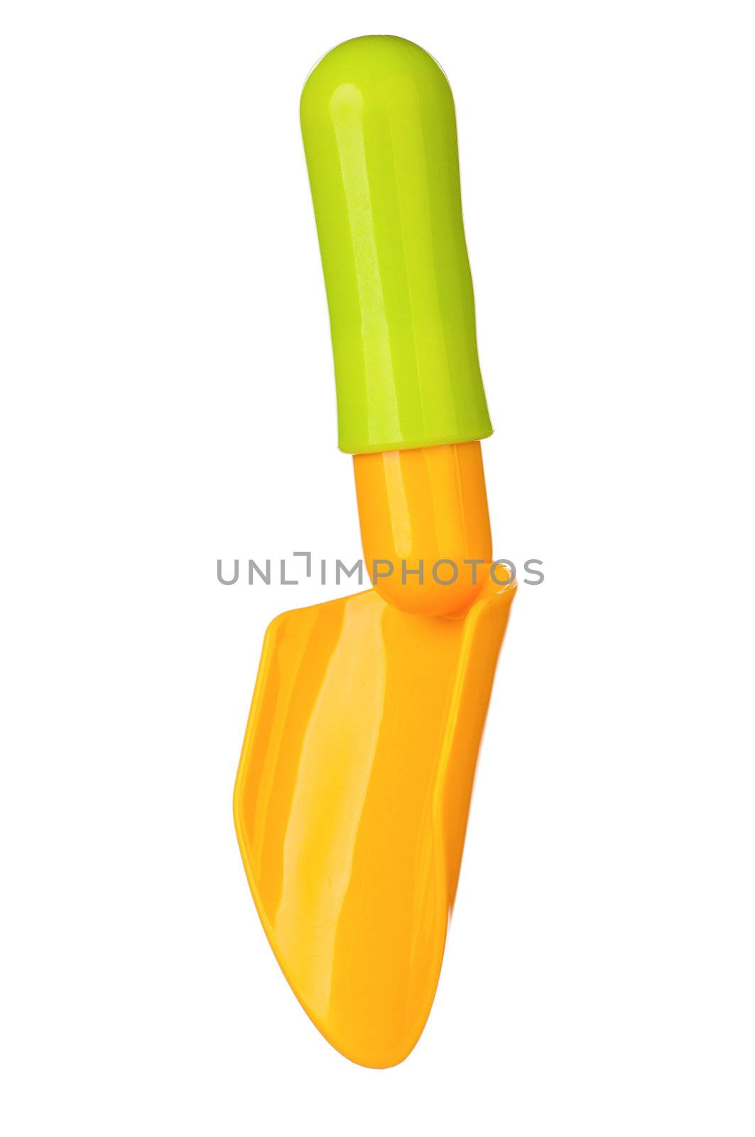 Toy small spade isolated on white background