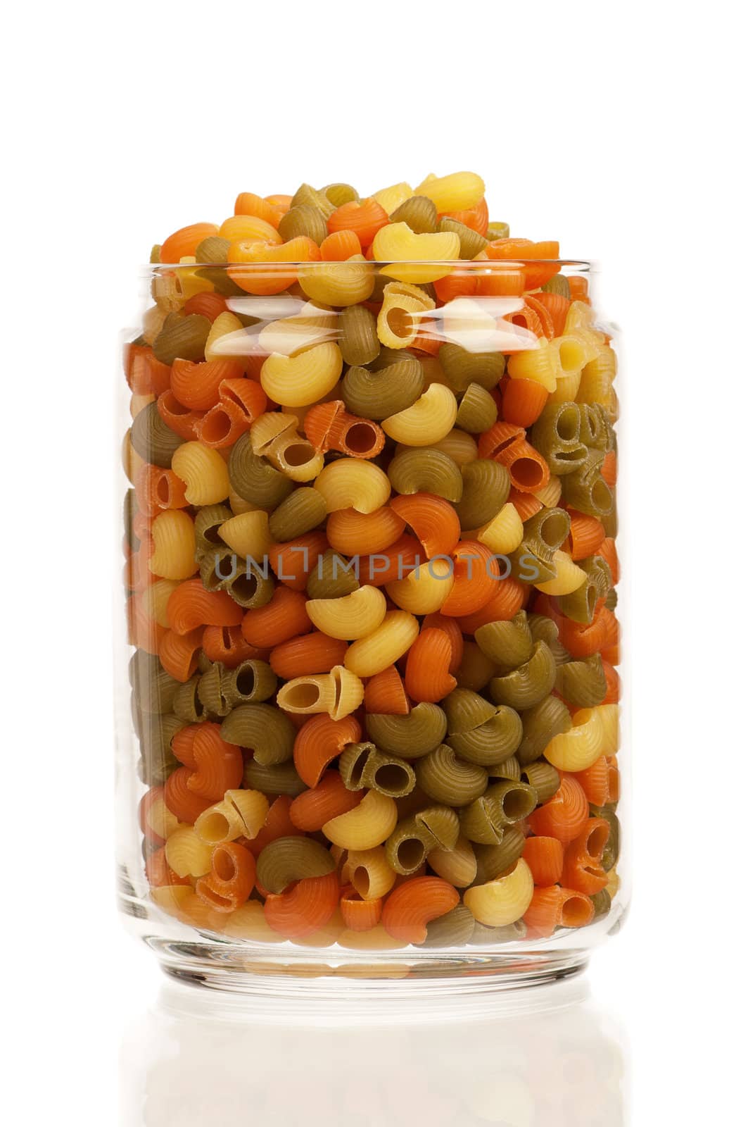 Pasta in glass pot isolated on white background