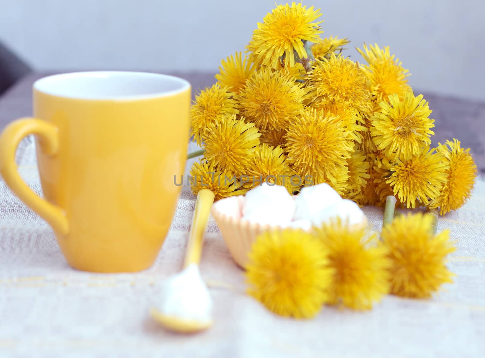 tea in glass cup and flowers by victosha