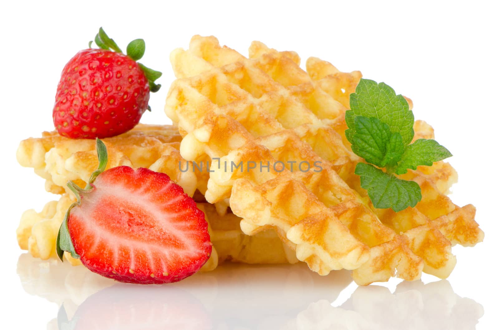 Waffles and strawberry isolated on white background.