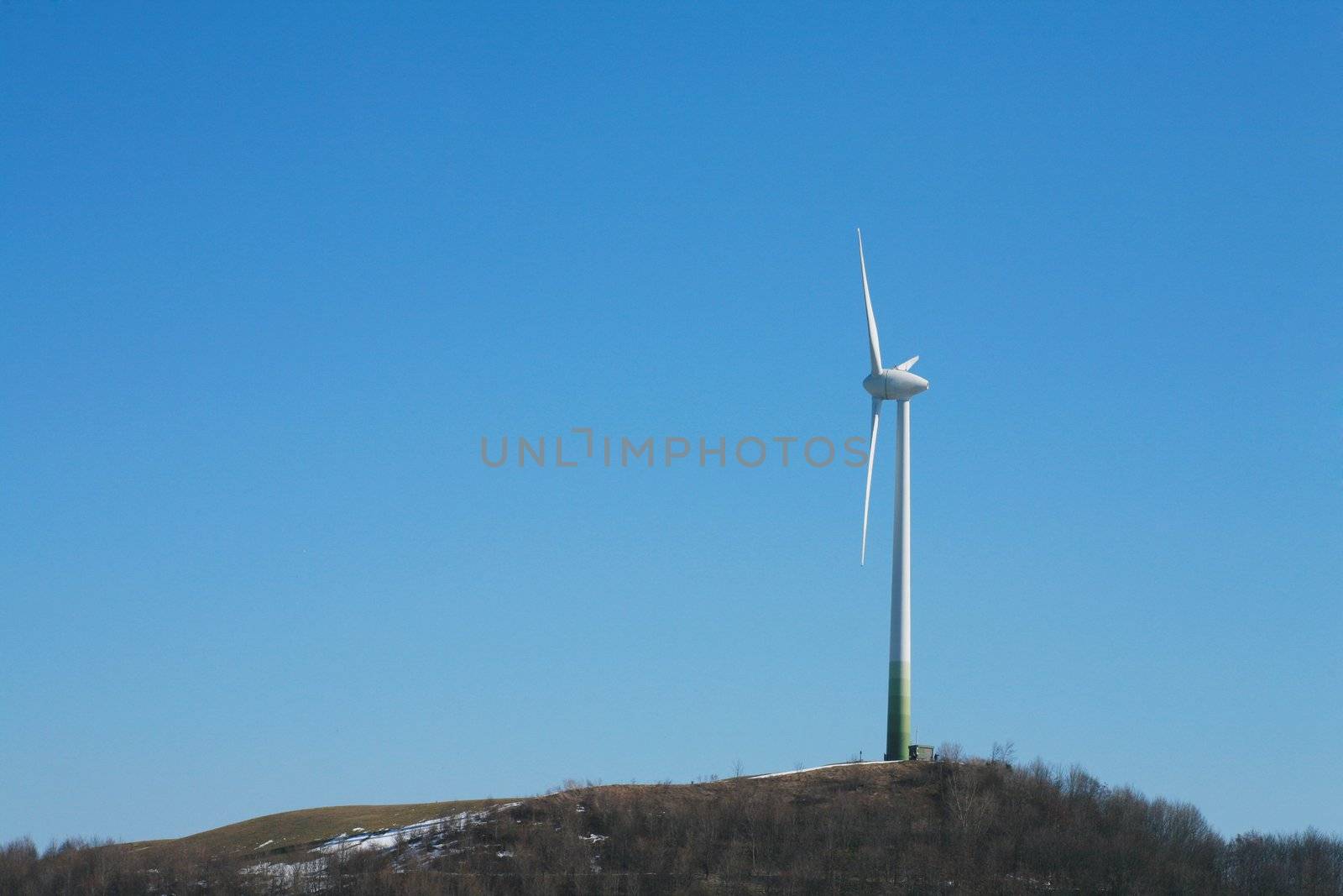 electric wind mill against the sky