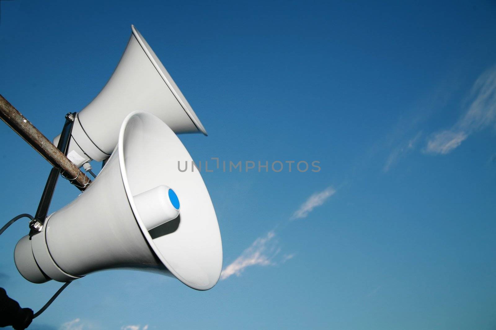 Loudspeaker against the sky clouds out side