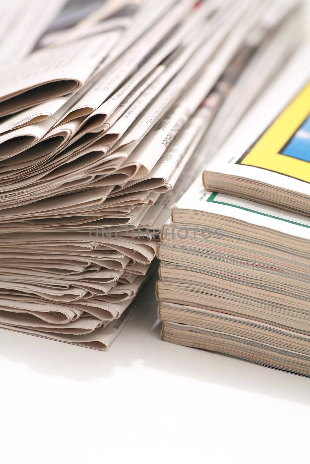 close-up of newspapers/magazine on a white backgroung.