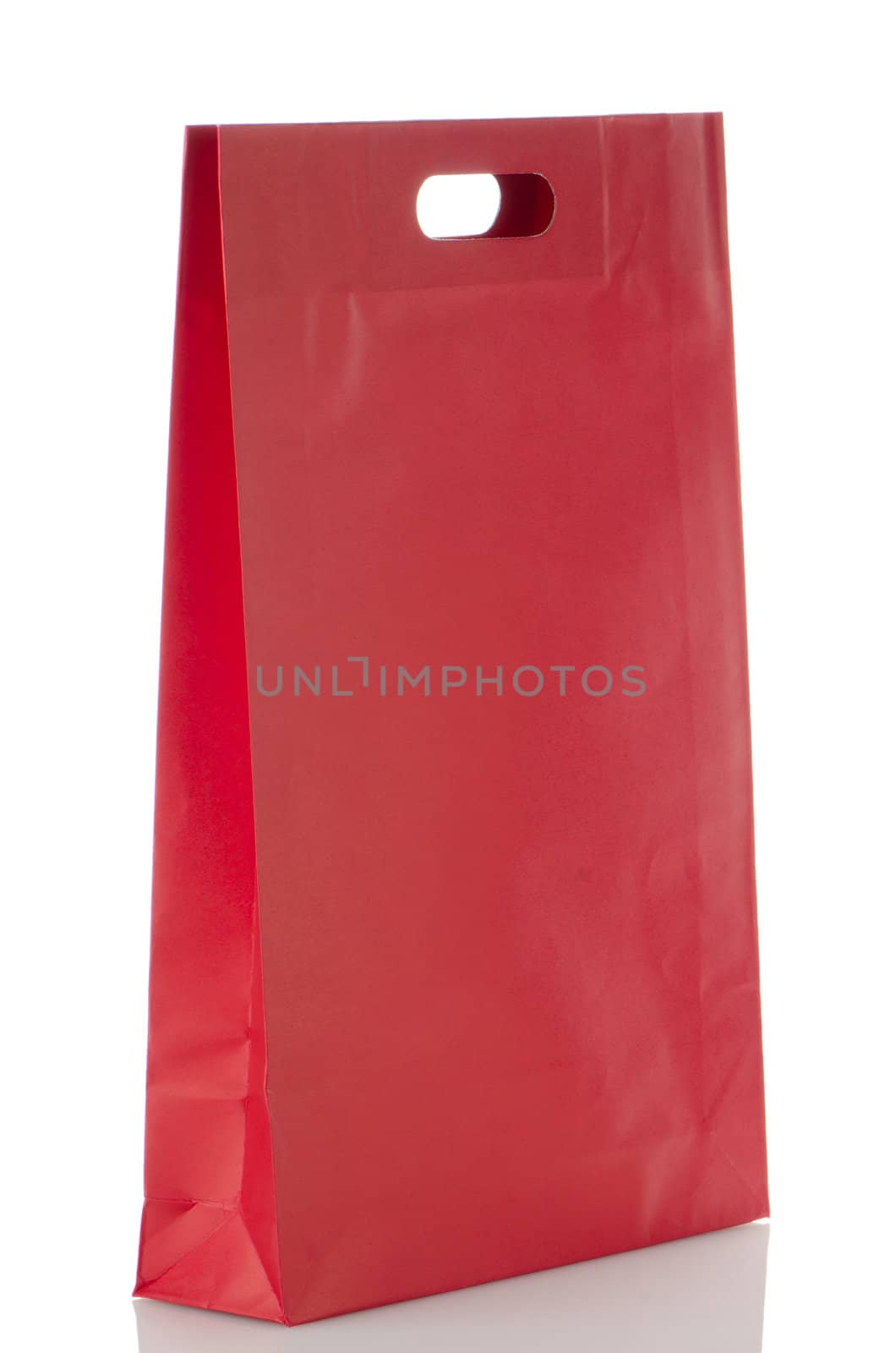Red  paper bag over white background.