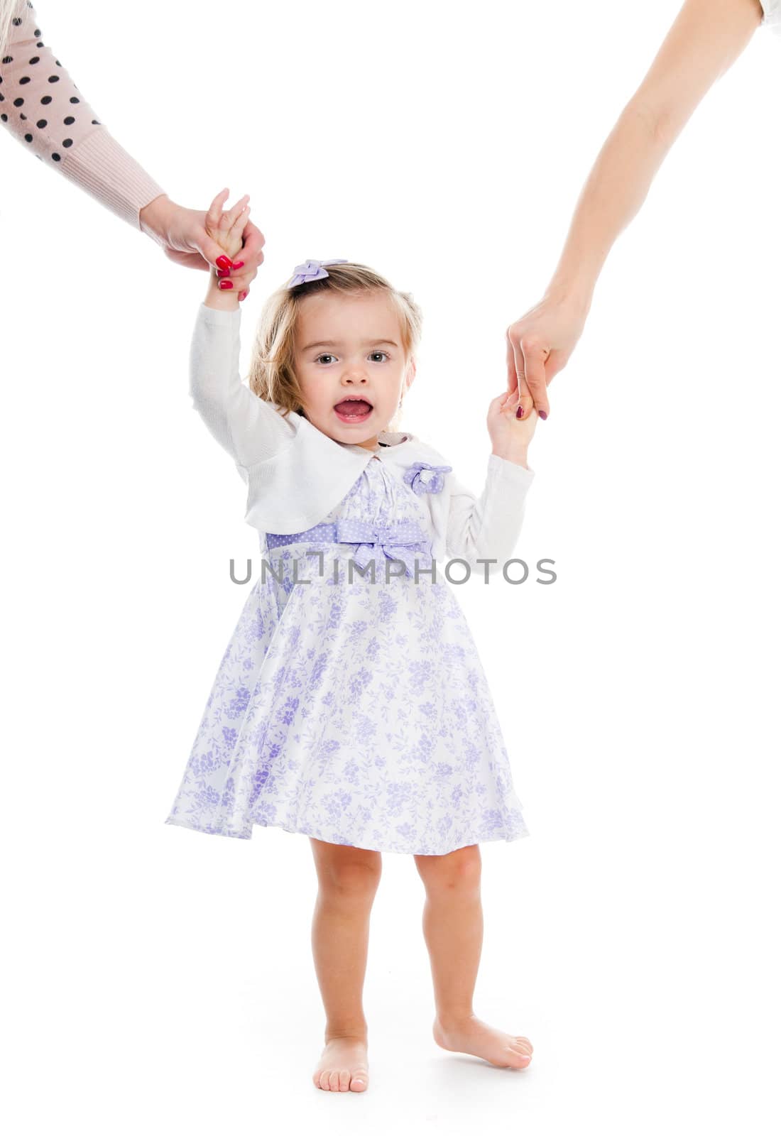 little girl holding the hand on white