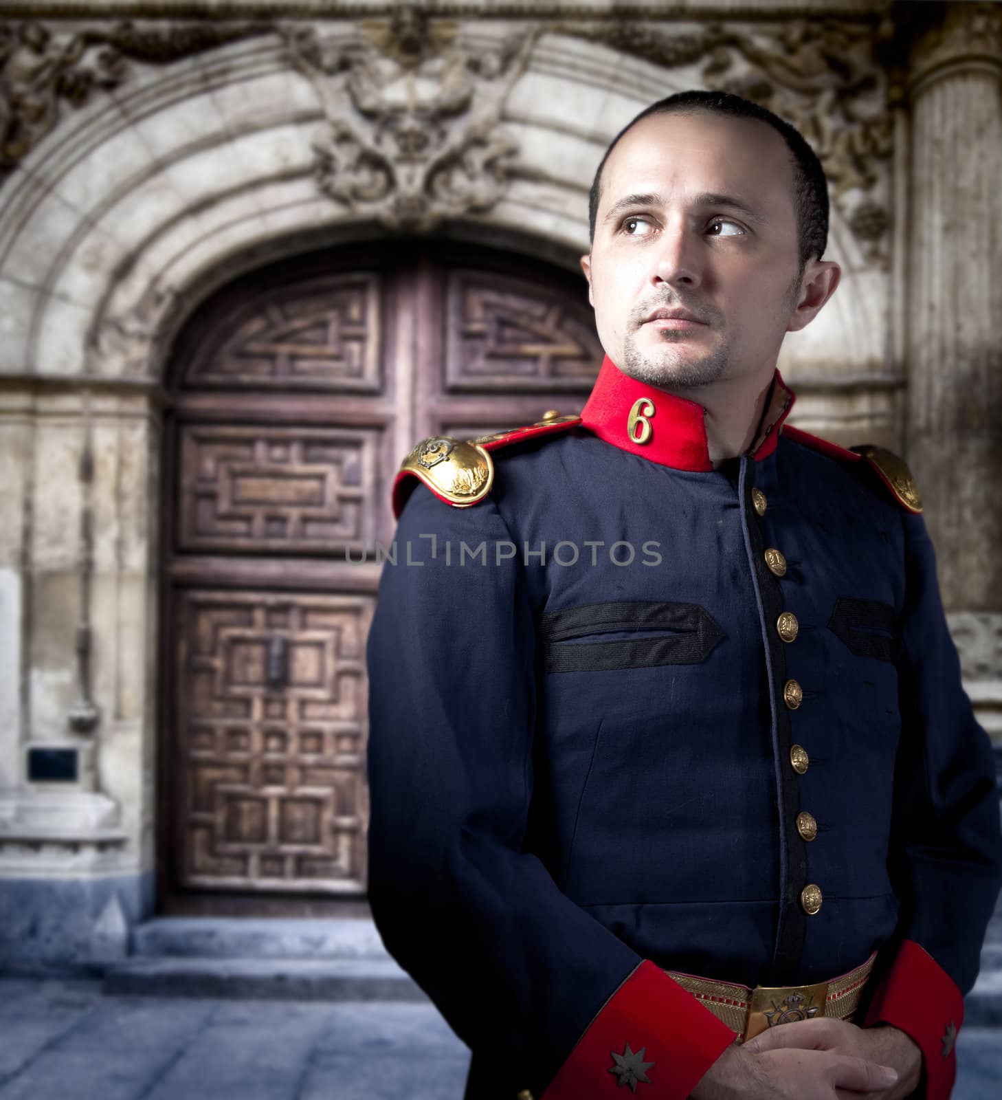 Antique soldier, man with military costume palace at background