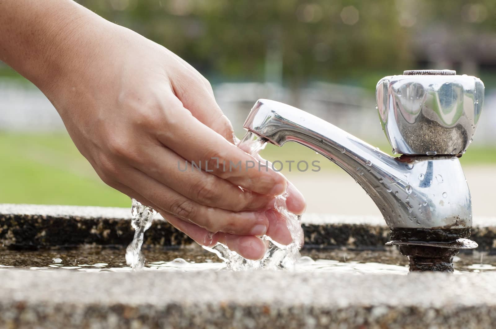 Washing Hands at outdoor     
faucet