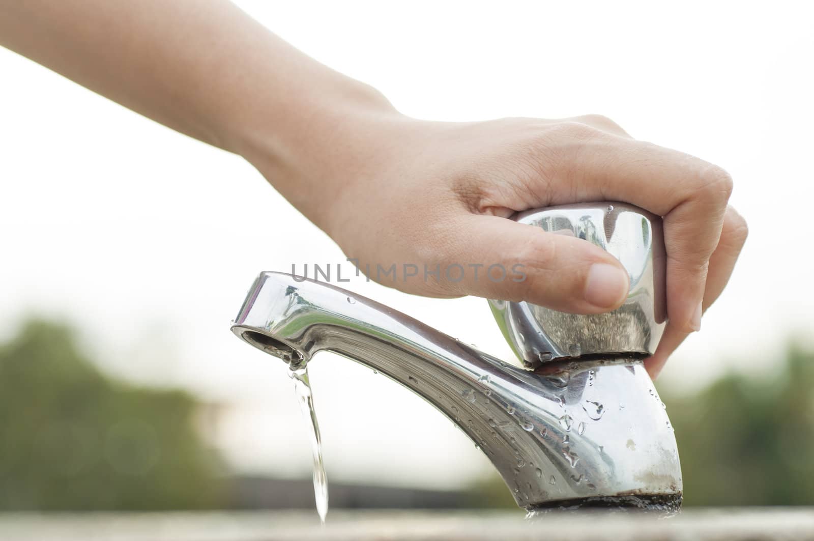 Hand shuting faucet. Saving water concept