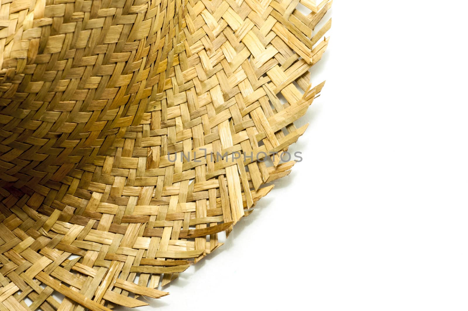 Part of straw hat  on a white background by TanawatPontchour