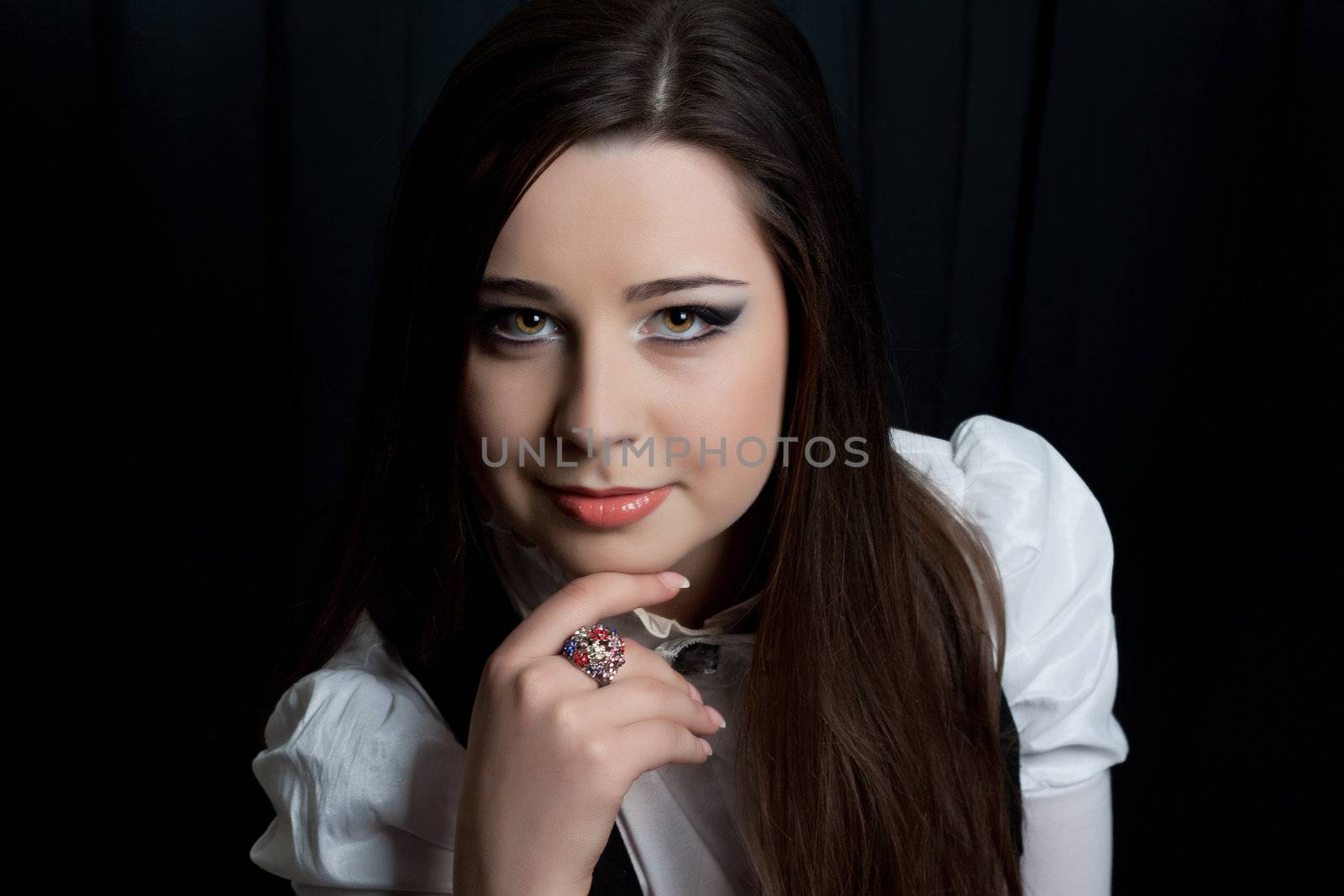 beautifull brunette , shooting in the studio with dark background 