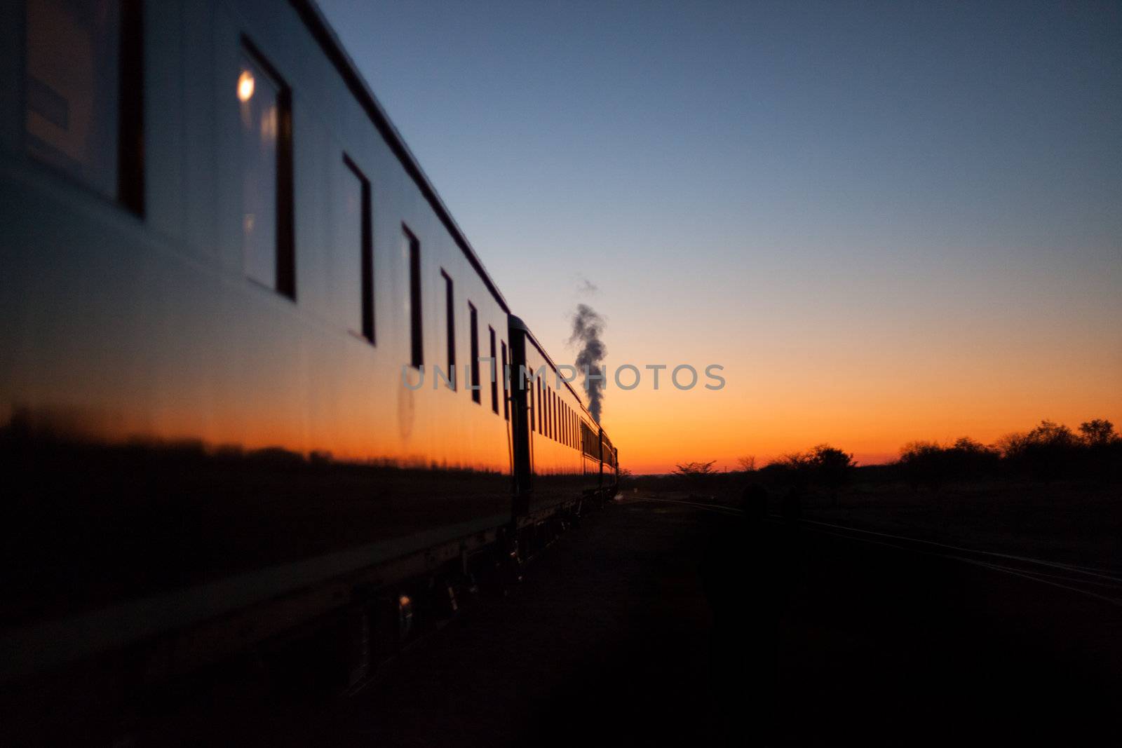 Vintage train going off into the sunset