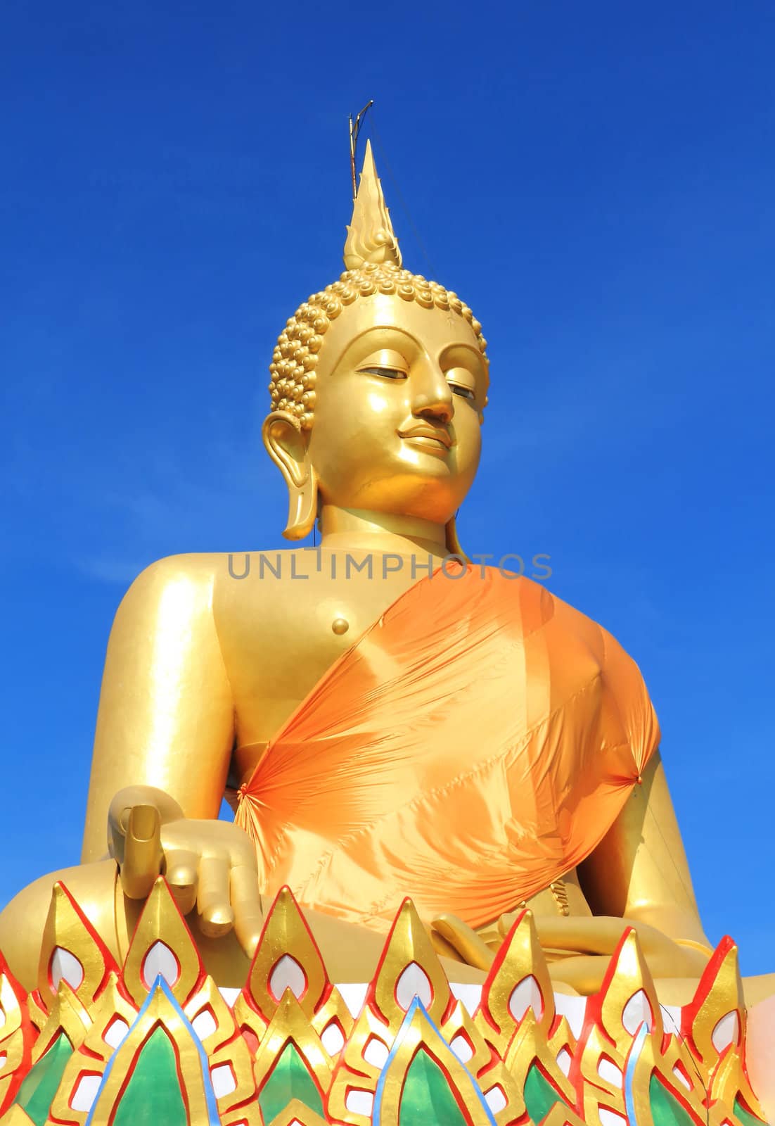 View of a big buddha statue with a blue sky, Pathumthani, Thailand