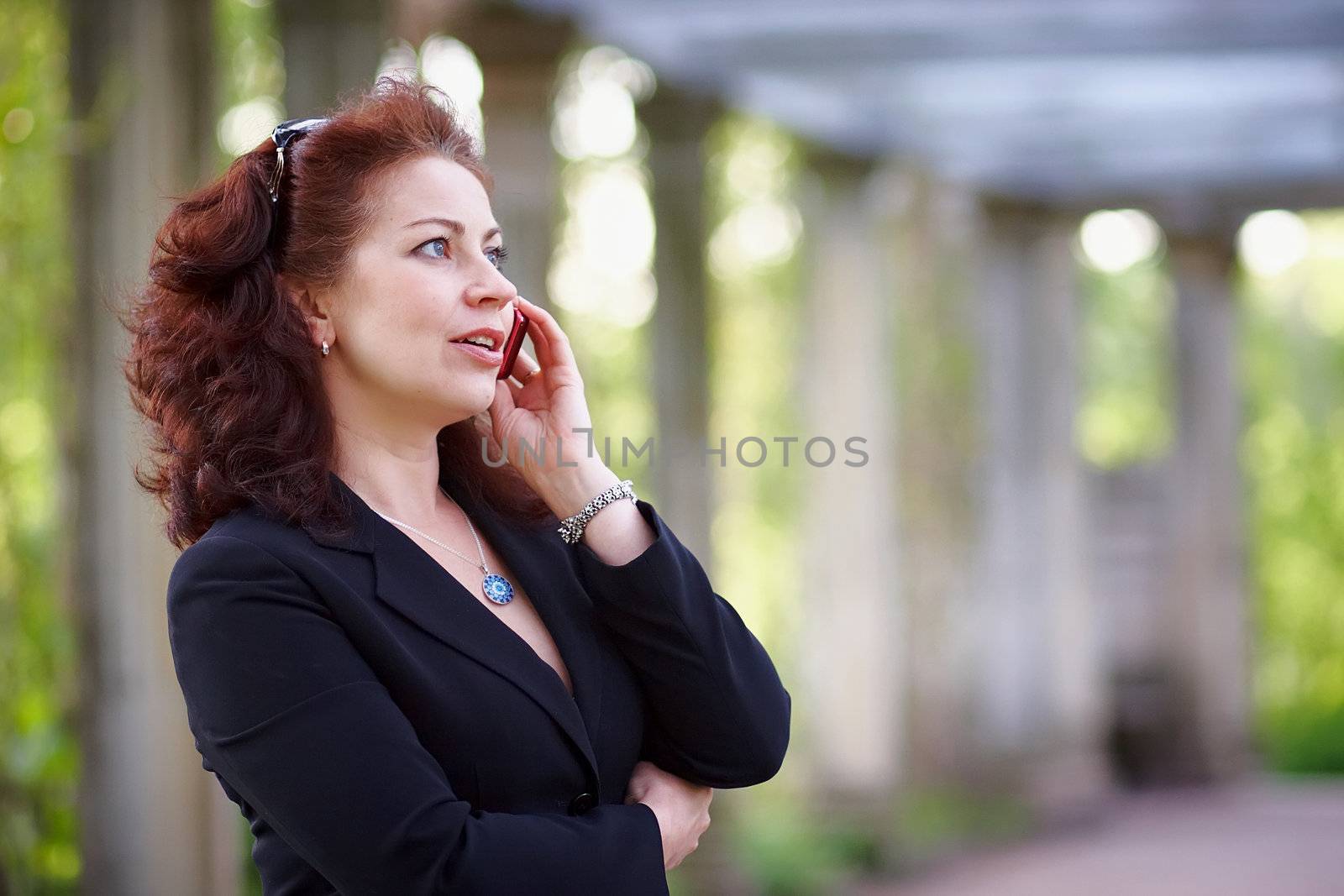 Portrait of the beautiful business woman with phone