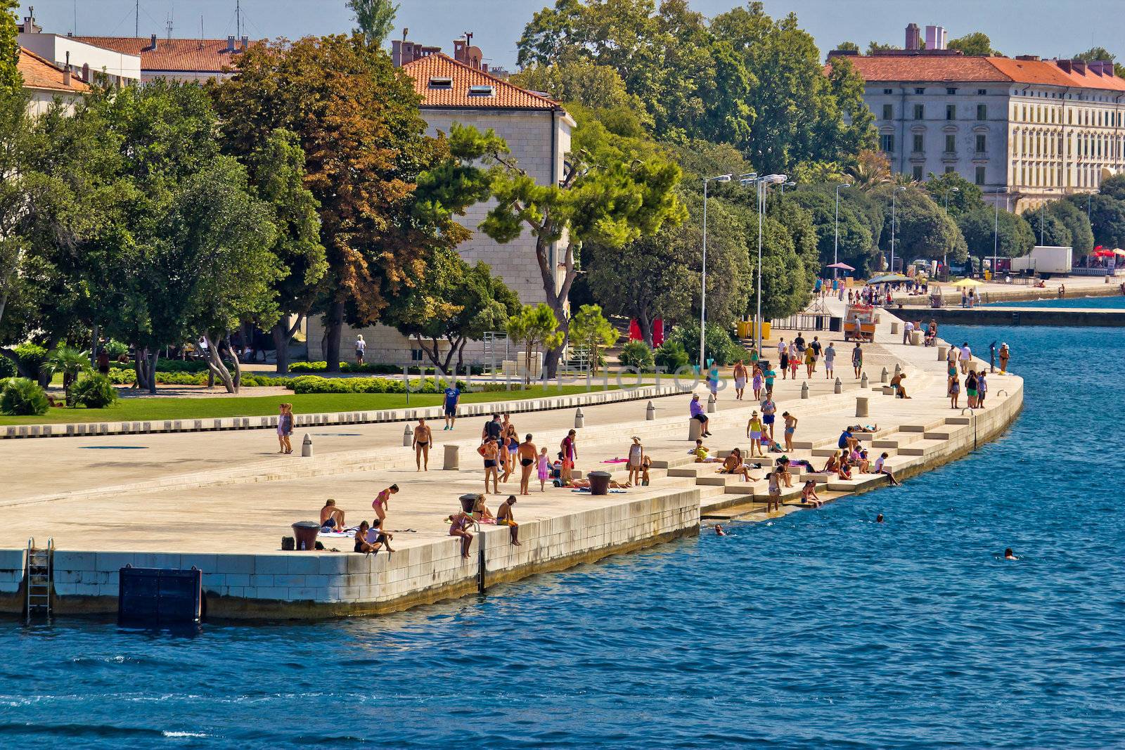 ZADAR, CROATIA - AUGUST 24th 2012: Zadar sea organs . Many tourists visits architectural object which is unique on the world, located on Zadar waterfront - musical instrument powered by the sea streams.