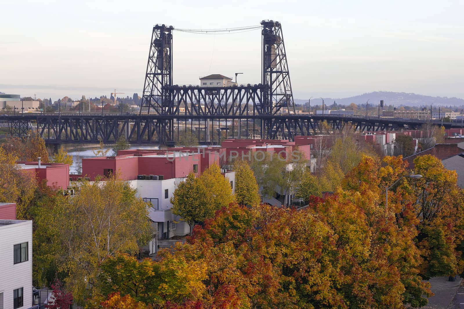 Steel Bridge Over Willamette River with Fall Color Trees in Portland Oregon