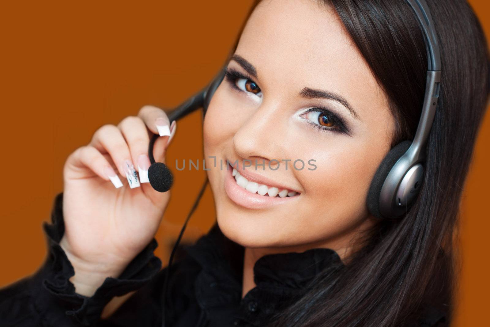 beautiful girl with a headset looking at the camera 