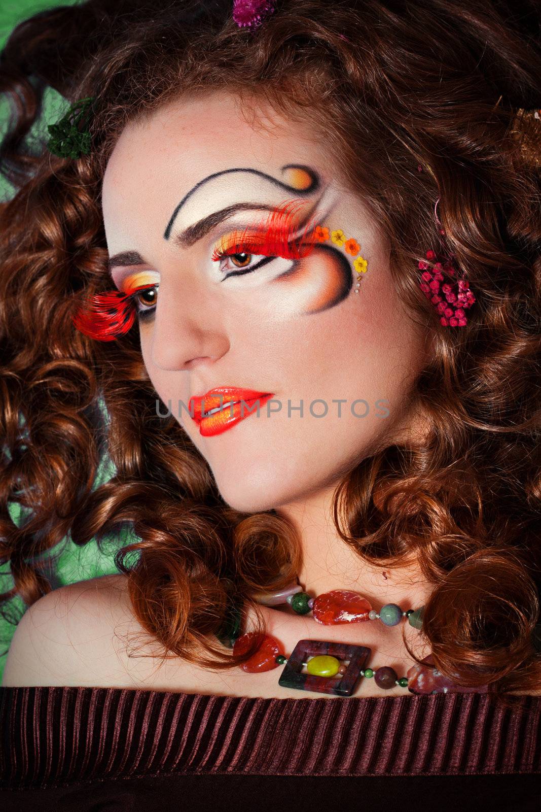 a close up portrait of a pretty redhead girl with professional makeup