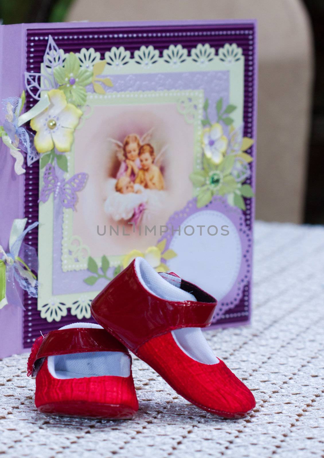 bebe shoes with a notbook with angles in the background