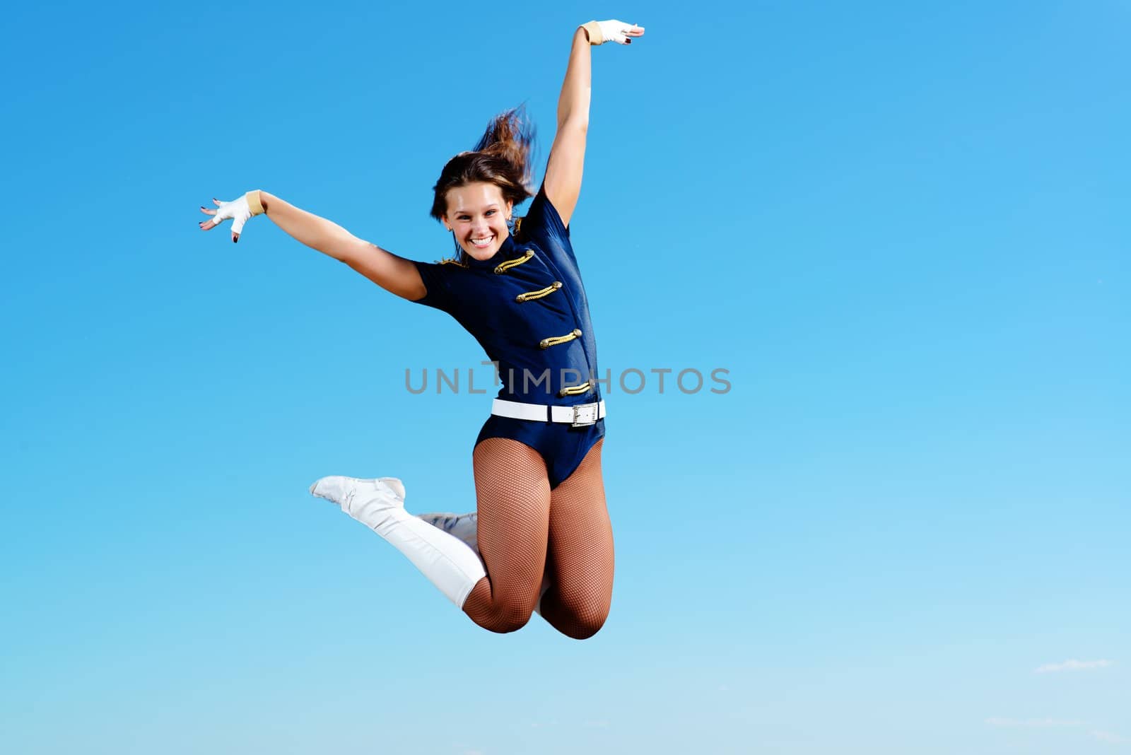 dancer jumping on a background of blue sky