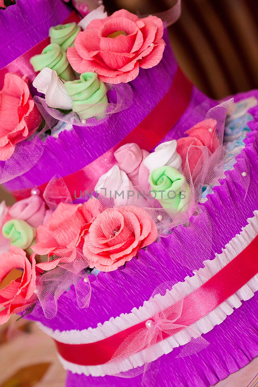 Decorative Cake made of flowers and new babe born's accessories