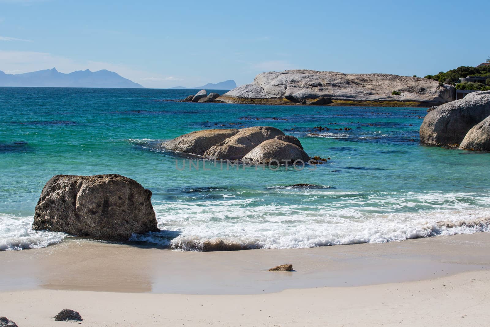 The beautiful coastal lines with blue and turquoise colored water of the Atlantic ocean near Cape Point in South Africa