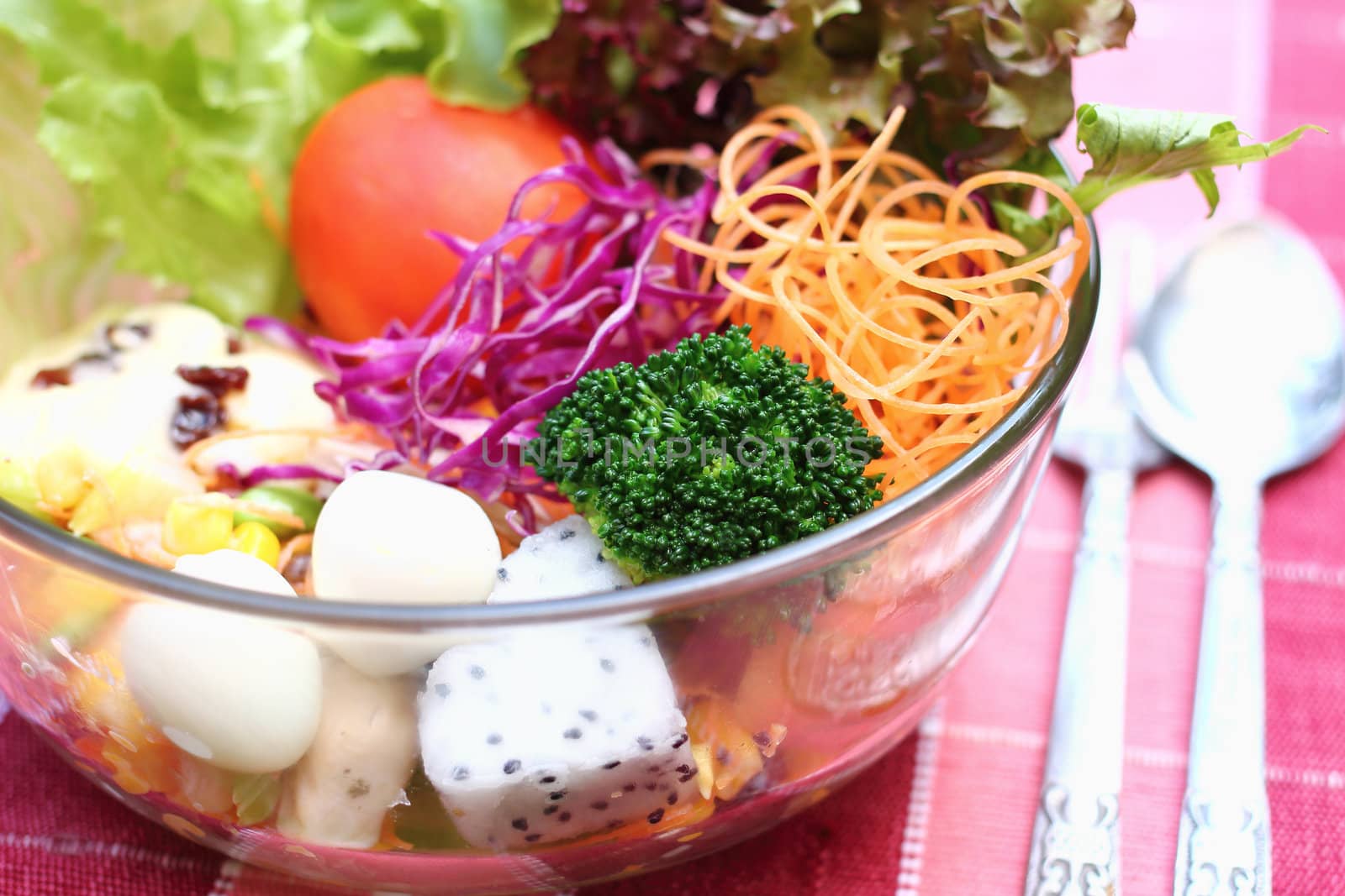 Close up salad in glass bowl with egg, vegetable and fruit