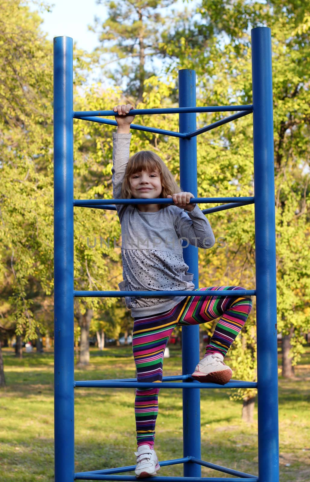 happy little girl fun on playground