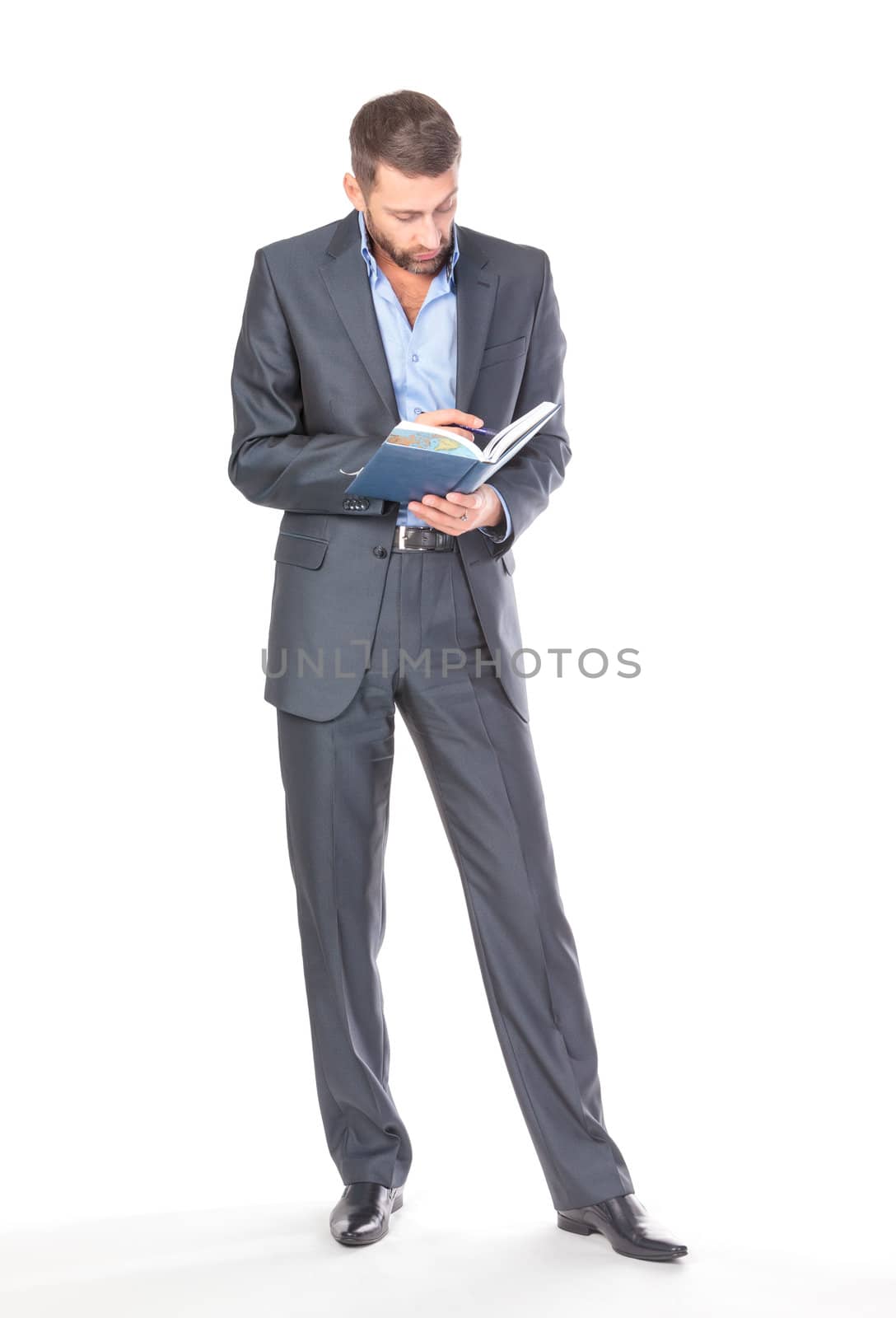 Full length portrait of thoughtful business man with diary, over white background