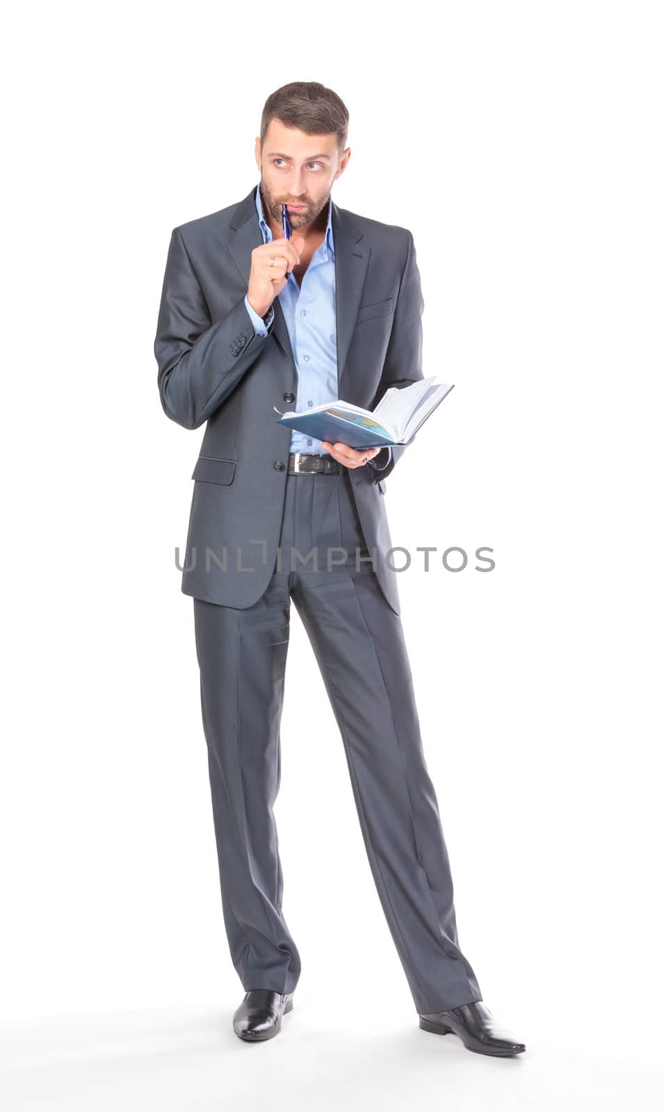 Full length portrait of thoughtful business man with diary, over white background
