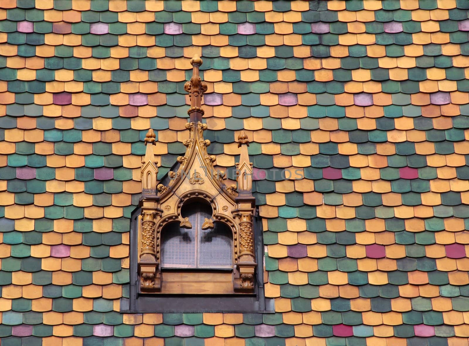 Ornamental roof tiles and roof windows.