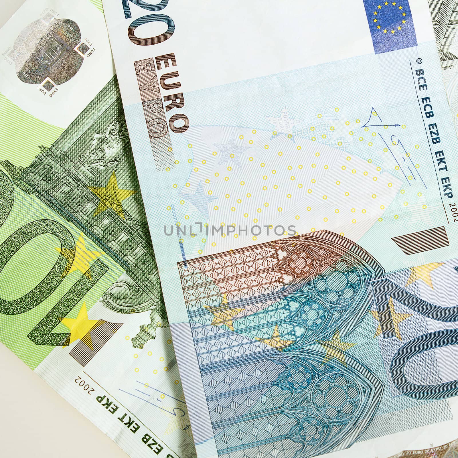 Euro banknotes arranged in background by artush