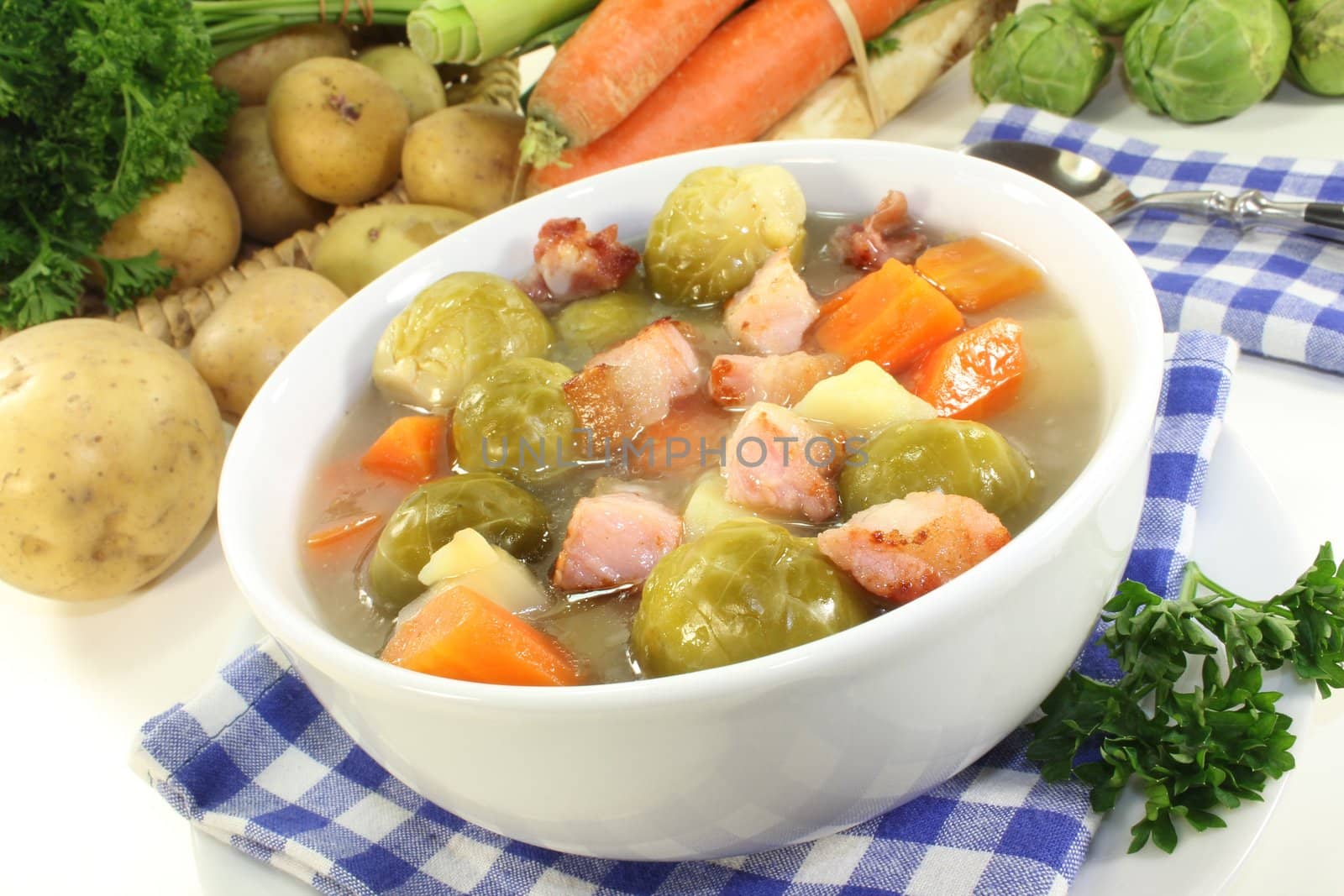 a bowl of Brussels sprouts stew with vegetables and bacon