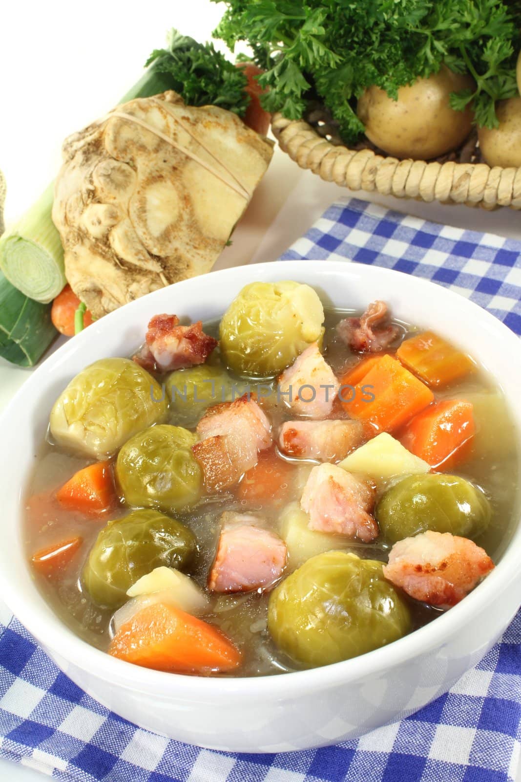 a bowl of Brussels sprouts stew with vegetables and bacon