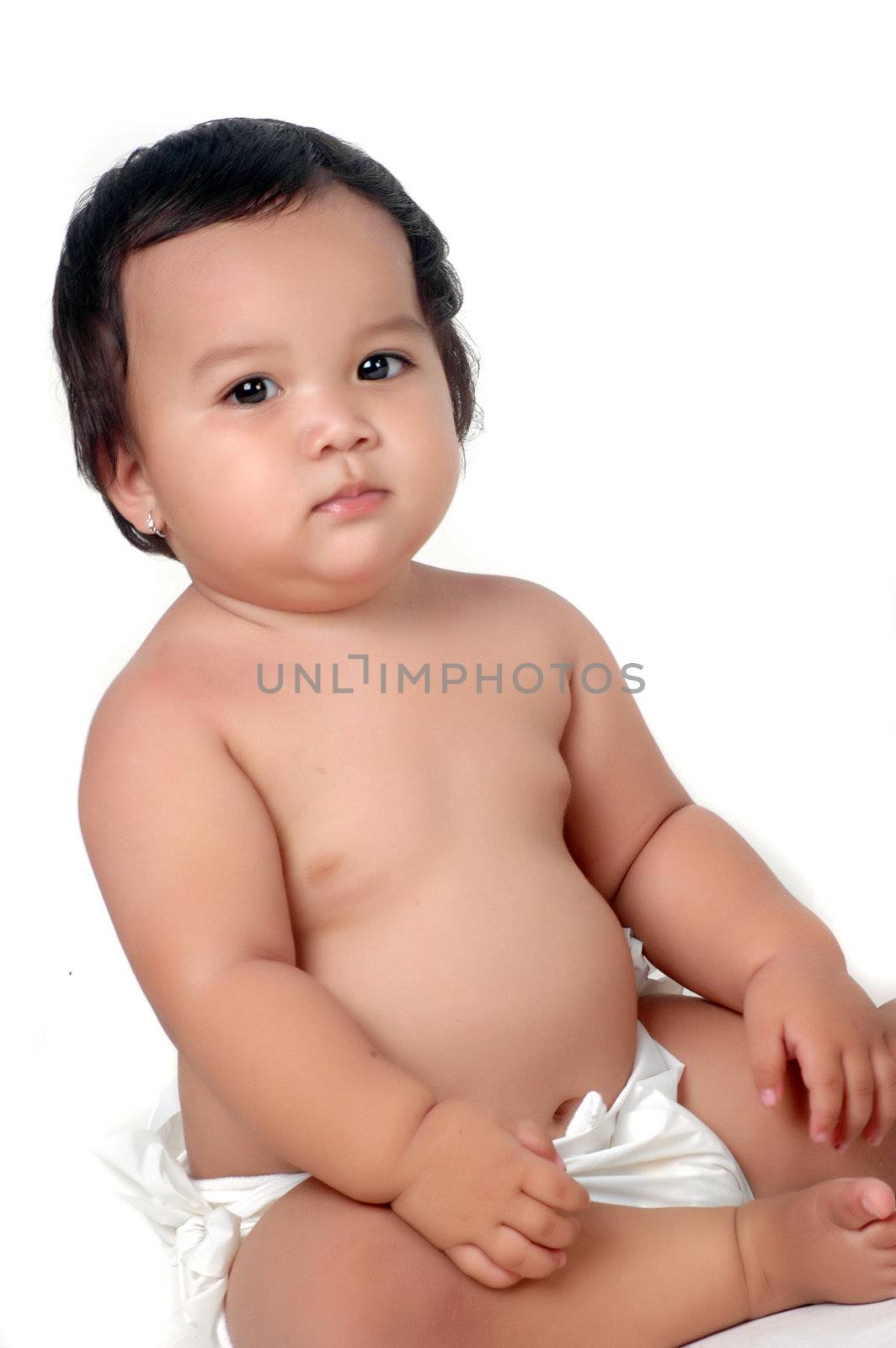 portrait chubby little girl was sitting isolated on white background