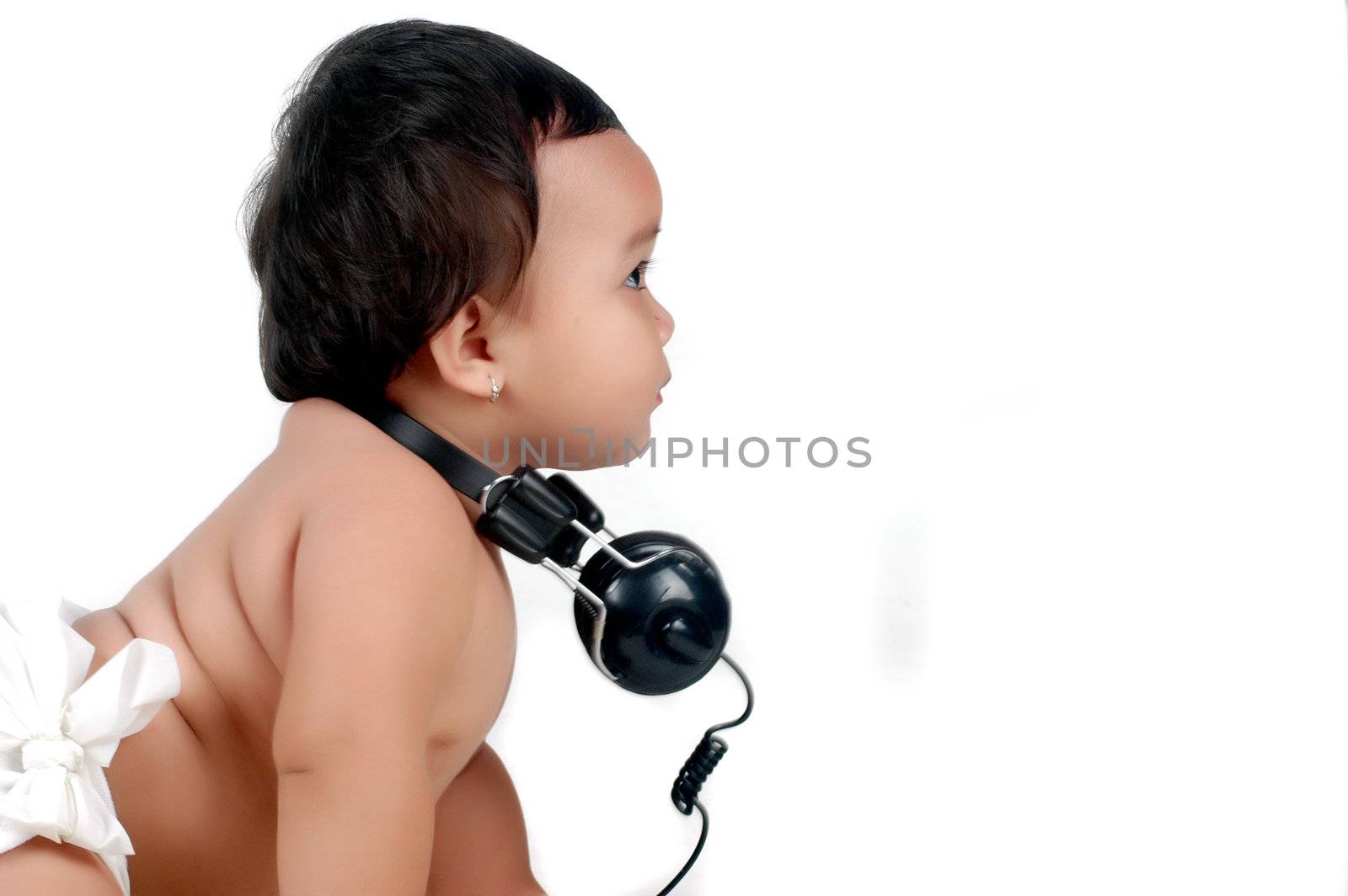 a chubby little girl with headphones isolated on white background