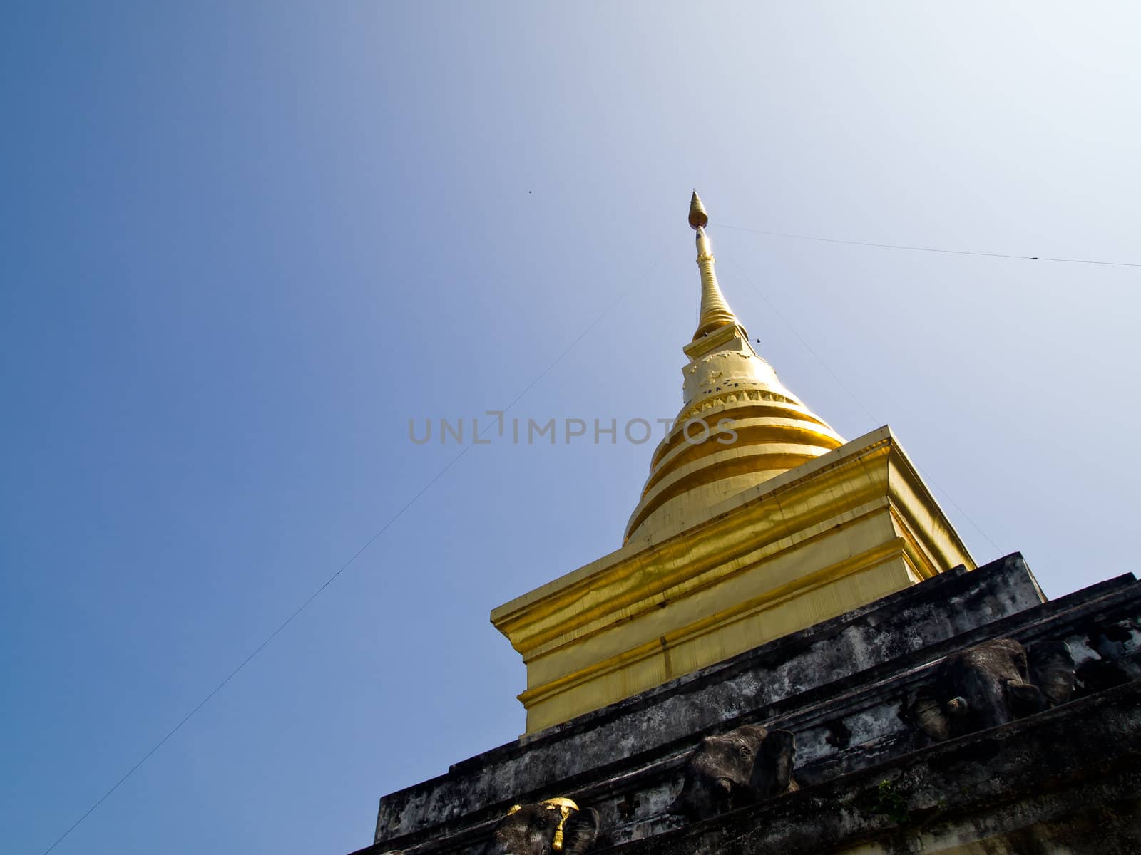 Golden stupa in Traditional Thai style which is in Wat Changkum (Nan-Thailand)