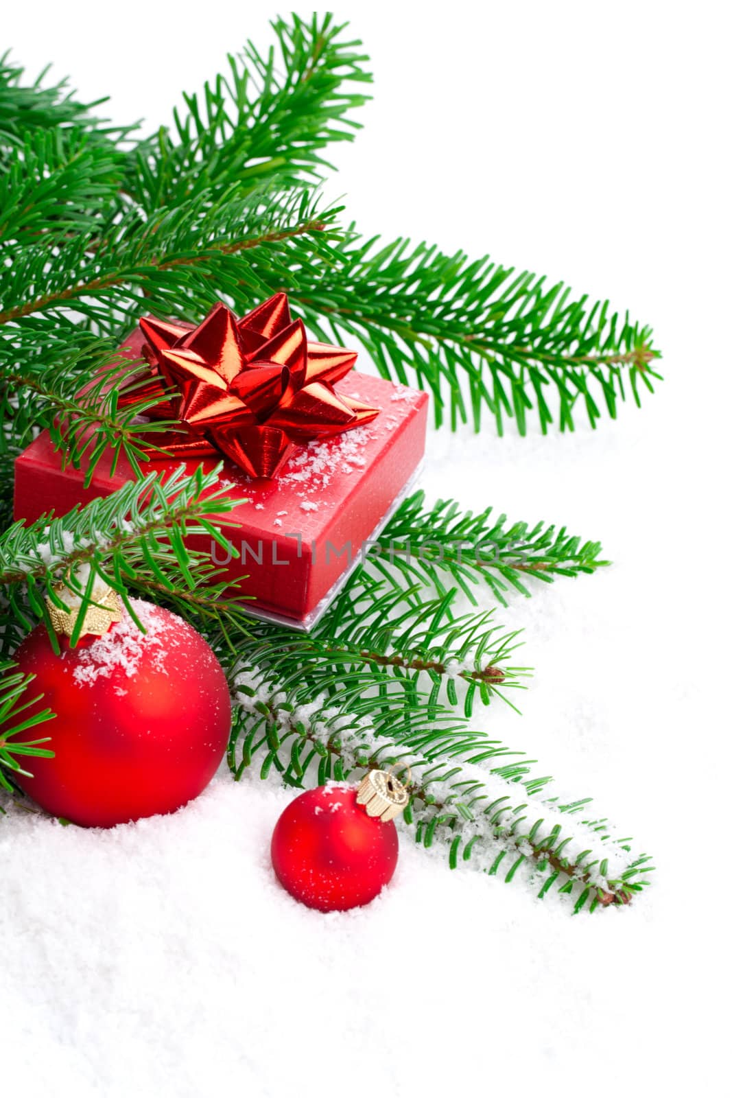 red Christmas ball with pine branch, gift and snow, isolated on  by motorolka