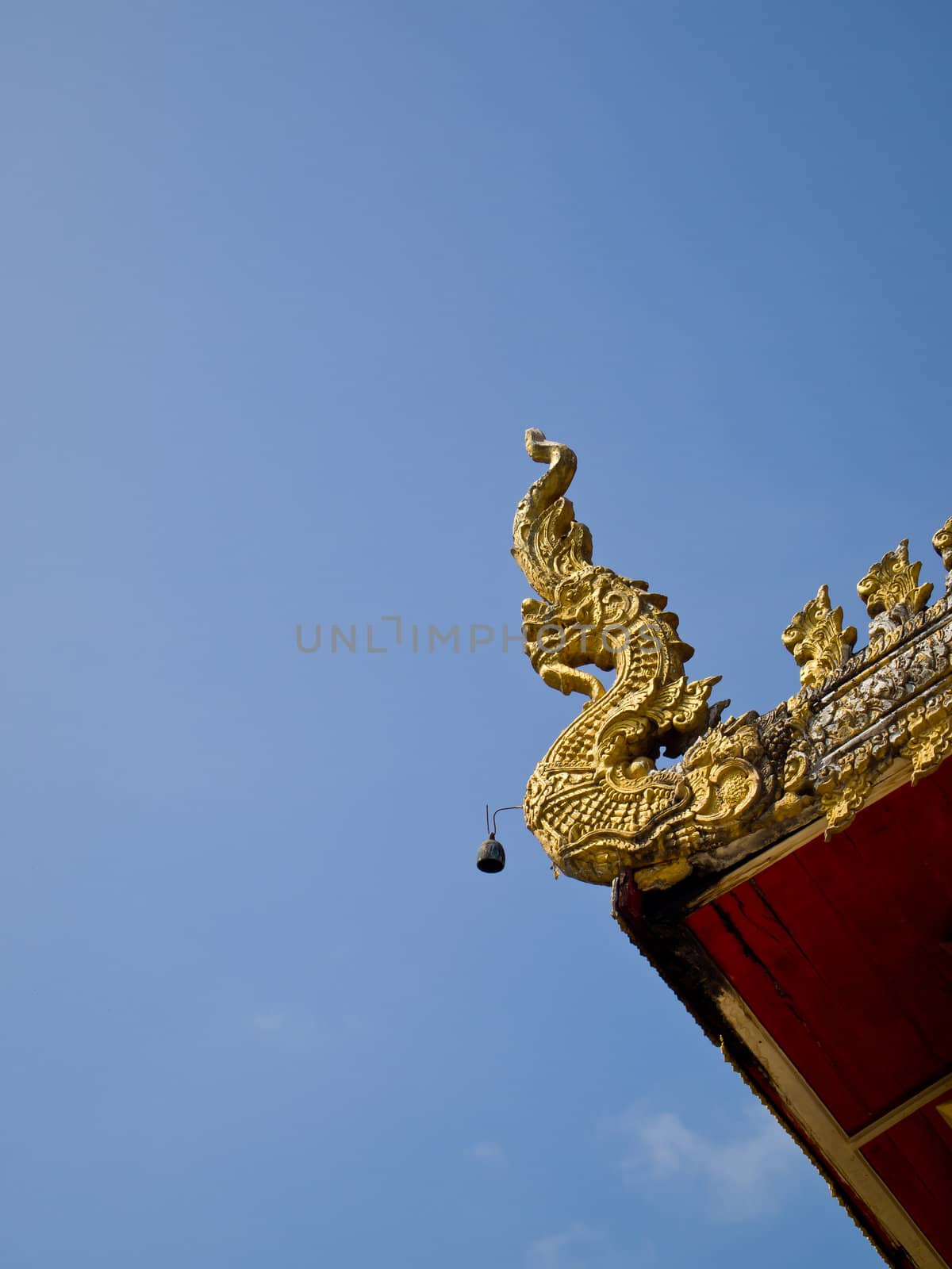 Golden naka gable apex in Wat Suantan (Nan-Thailand)