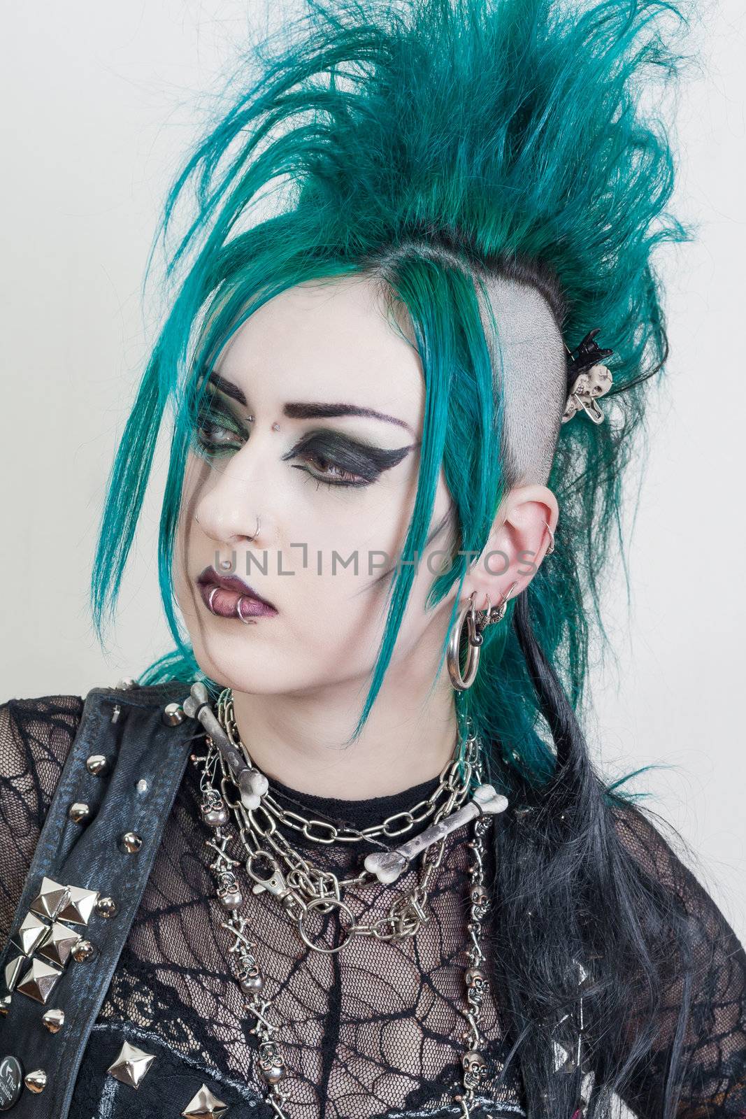 green haired postpunk girl on grey background