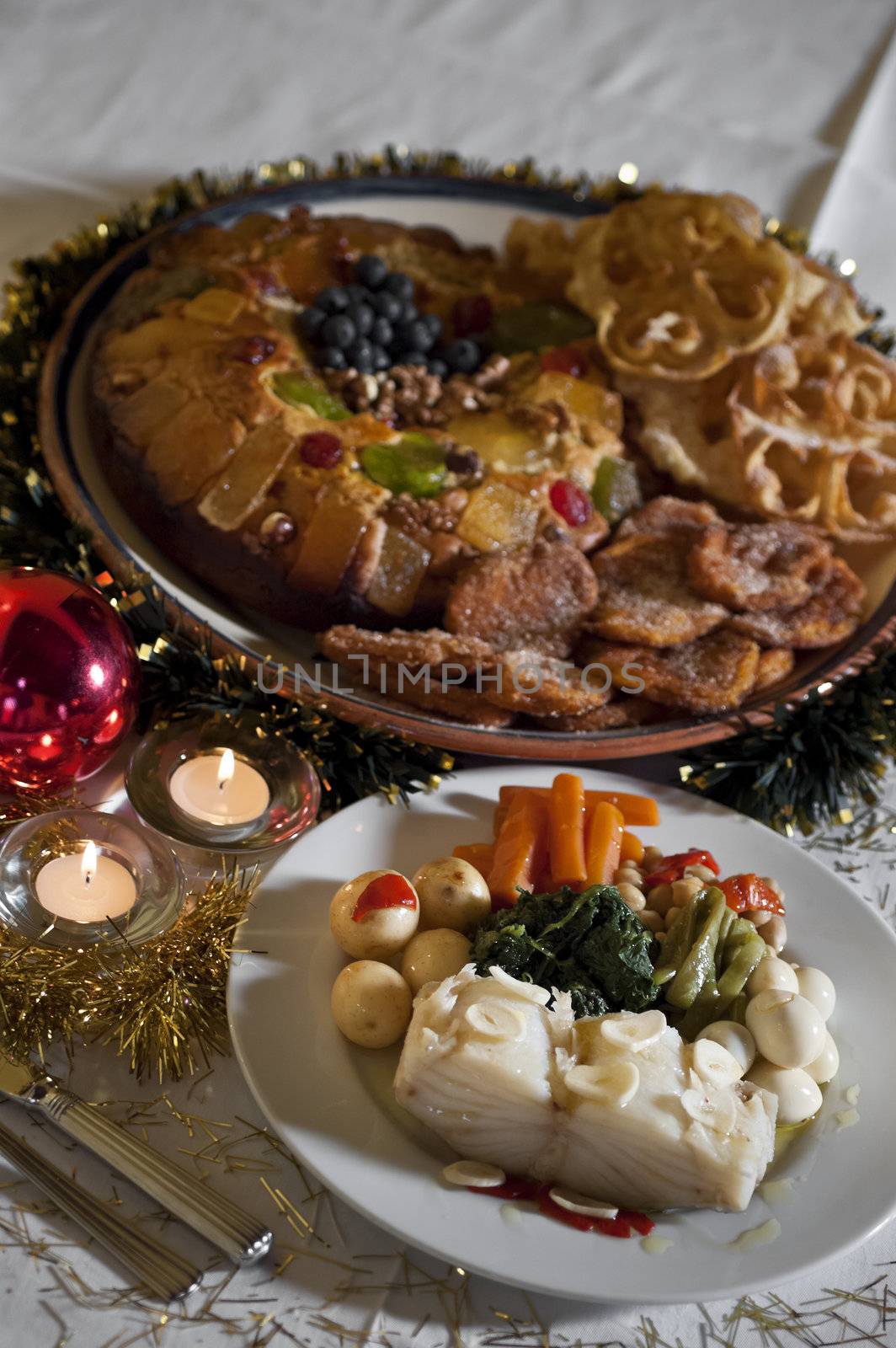 Real food photographed on location in traditional portuguese restaurants, Christmas supper with boiled codfish and various pastry, Alentejo, Portugal