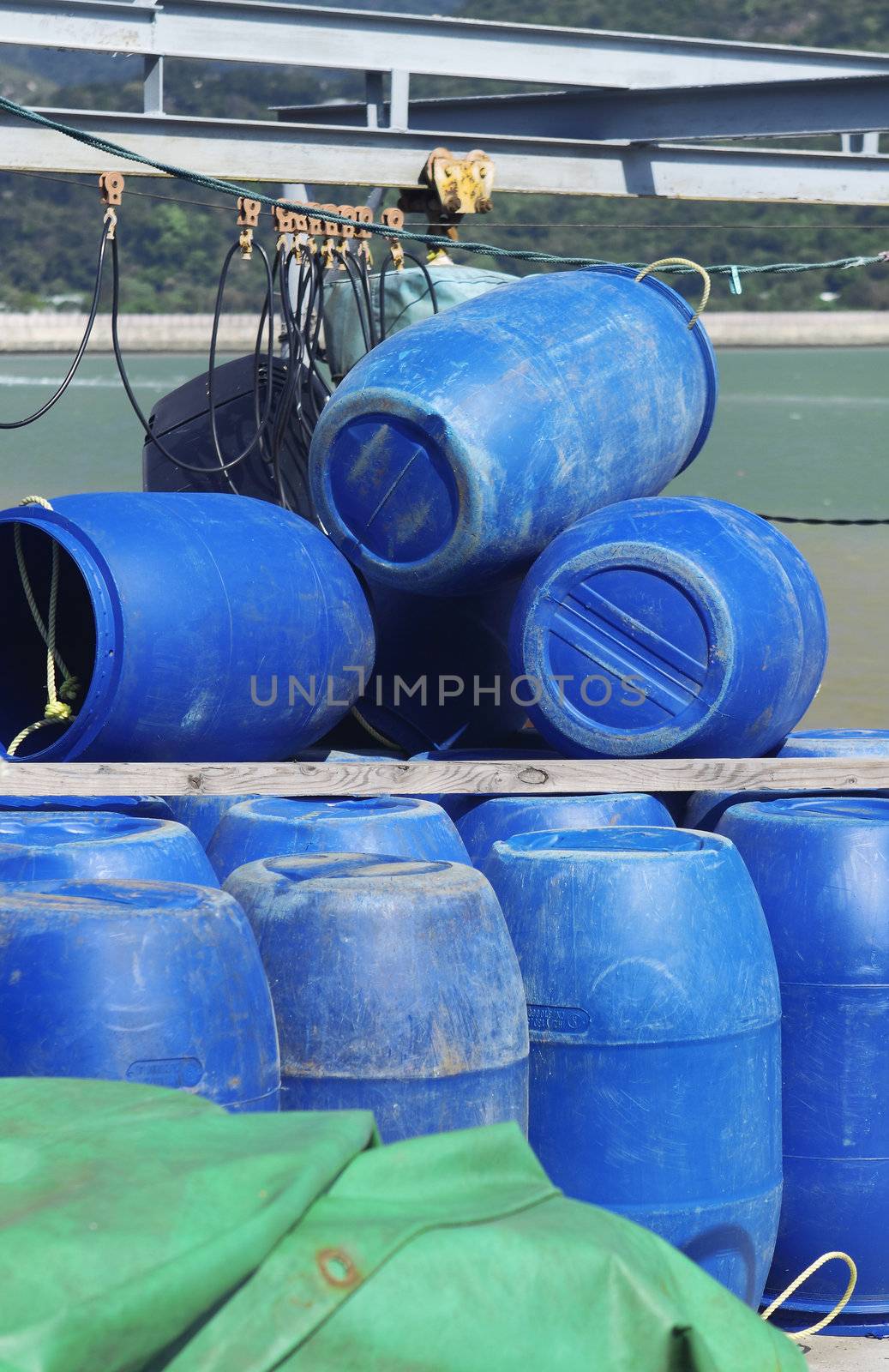 Blue plastic 200 litre barrel  by cozyta