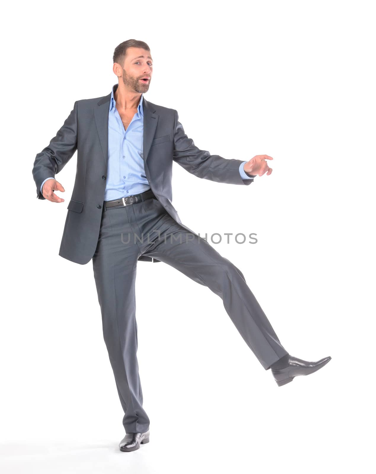 Full length portrait dancing businessman, over white background