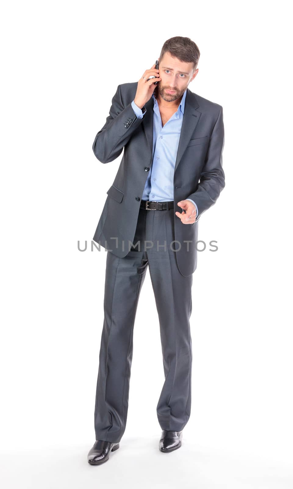 Full length portrait businessman with mobile phone, over white background